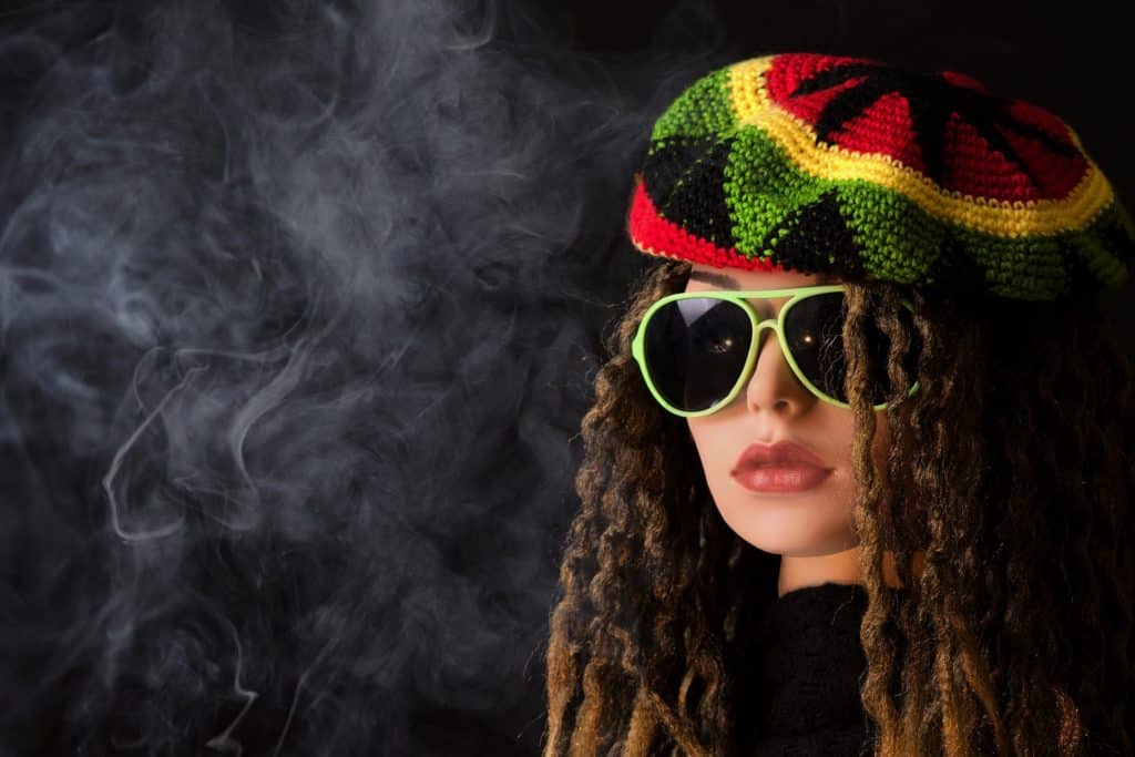Woman surrounded by marijuana smoke